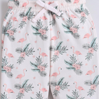 victor and jane girls shorts featuring a white base with a pink flamingo, tropical leaf, and floral print pattern