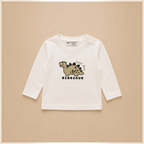 victor and jane boys long sleeve cream t-shirt with a cute dinosaur graphic and shoulder button closure