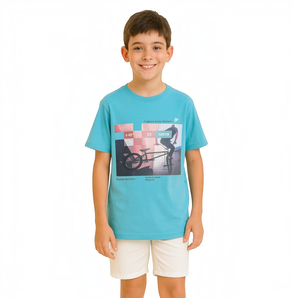 A young boy wearing a bright blue victor and jane graphic t-shirt featuring a bicycle design on a white background.