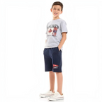 victor and jane boy wearing a grey graphic t-shirt with a maple leaf print and navy blue shorts with flag details