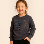 Young girl wearing a victor and jane grey cotton sweatshirt with a Brave Heart graphic and leopard print design