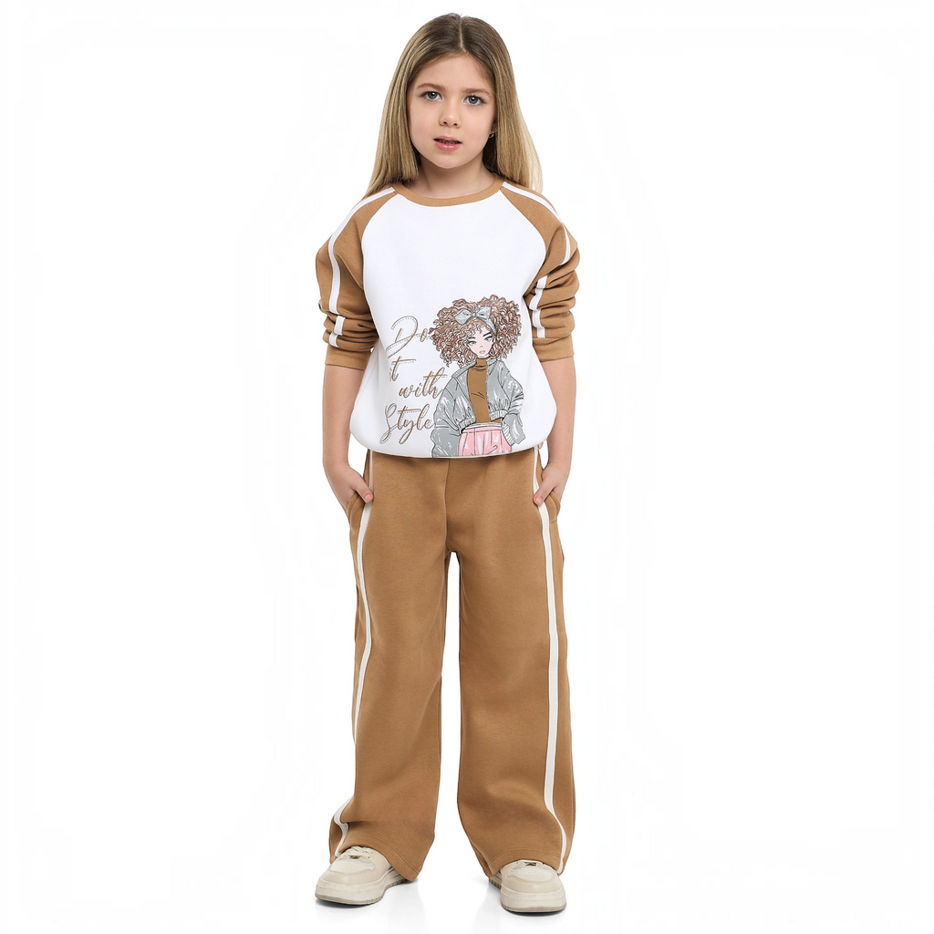 Young girl wearing a victor and jane two-piece set featuring a brown and white sweatshirt and matching wide-leg pants