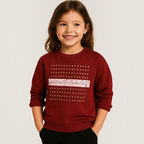 Young girl wearing a burgundy victor and jane sweatshirt with gold stud details and perfectly fabulous text graphic
