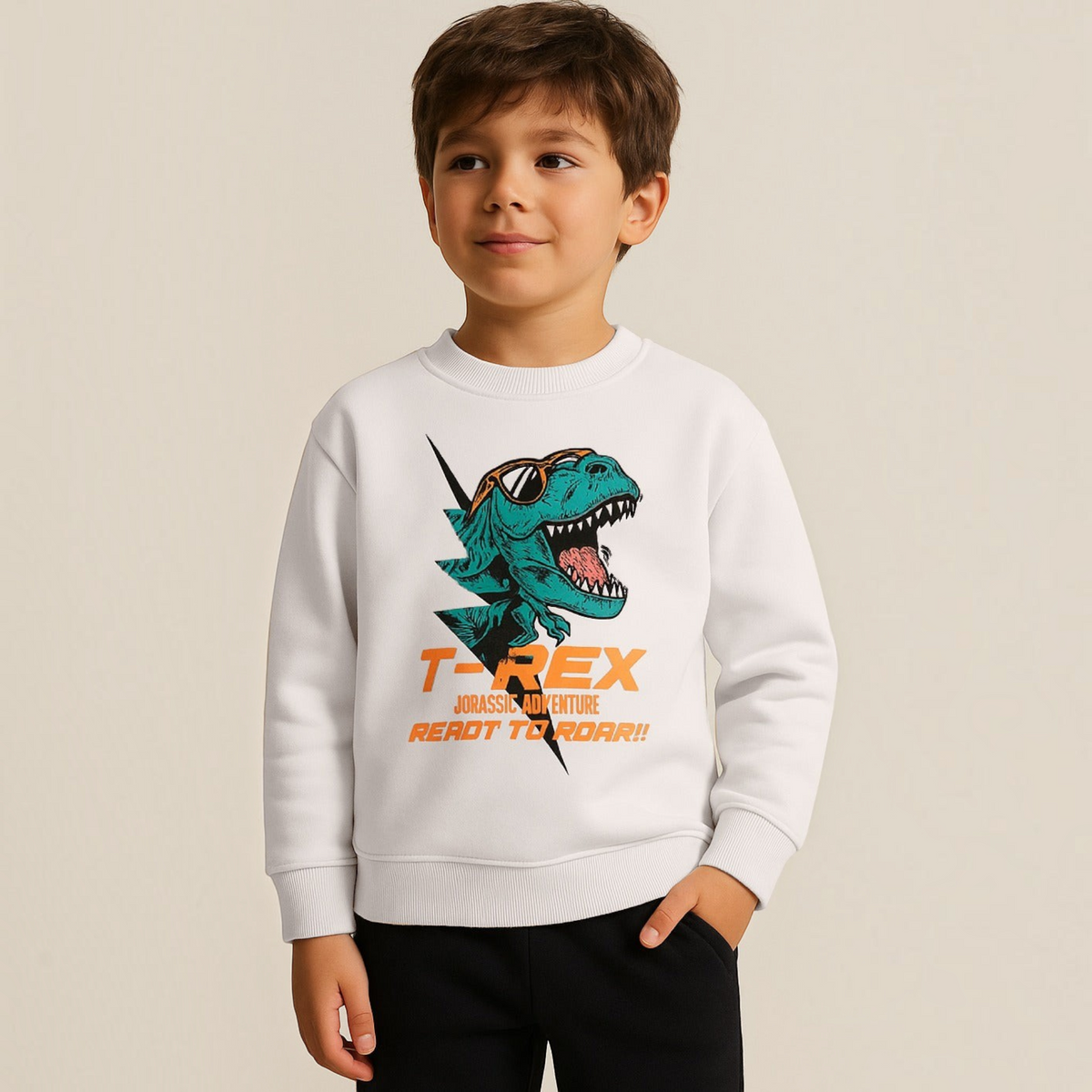 A young boy wearing a white victor and jane graphic sweatshirt featuring a cool T-Rex print with sunglasses.